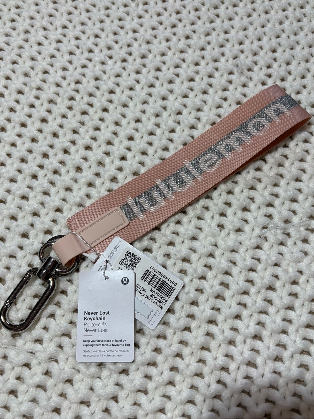 NWT lululemon never lost keychain in pink mist/silver